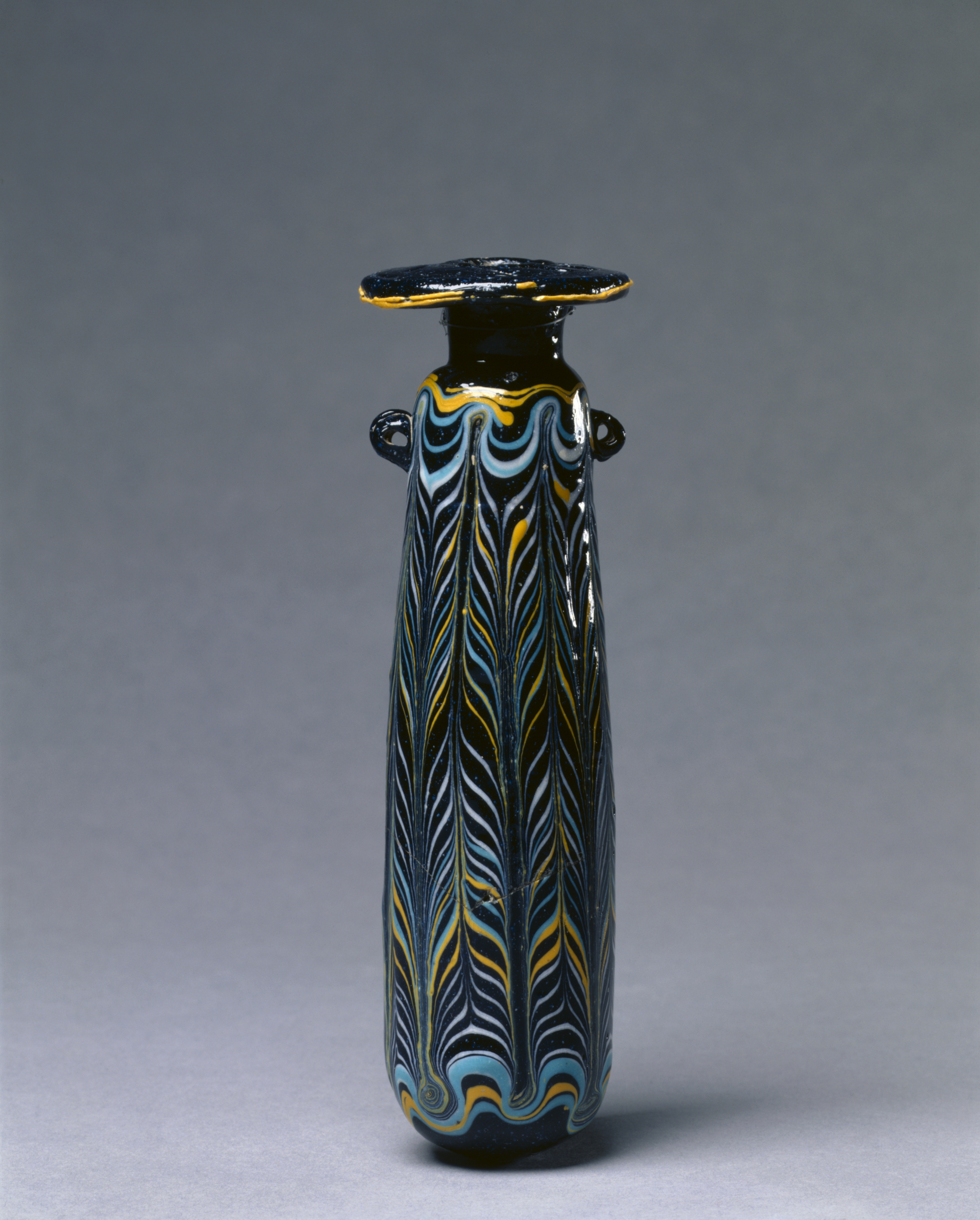 Ancient Etruscan glass perfume bottle, c. 325–275 BCE.jpg