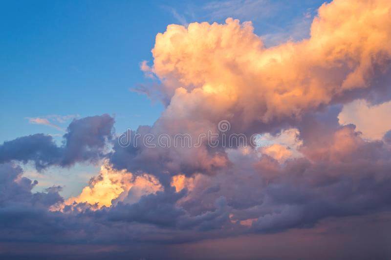 big-fluffy-yellow-blue-clouds-bright-sky-153566853.jpg