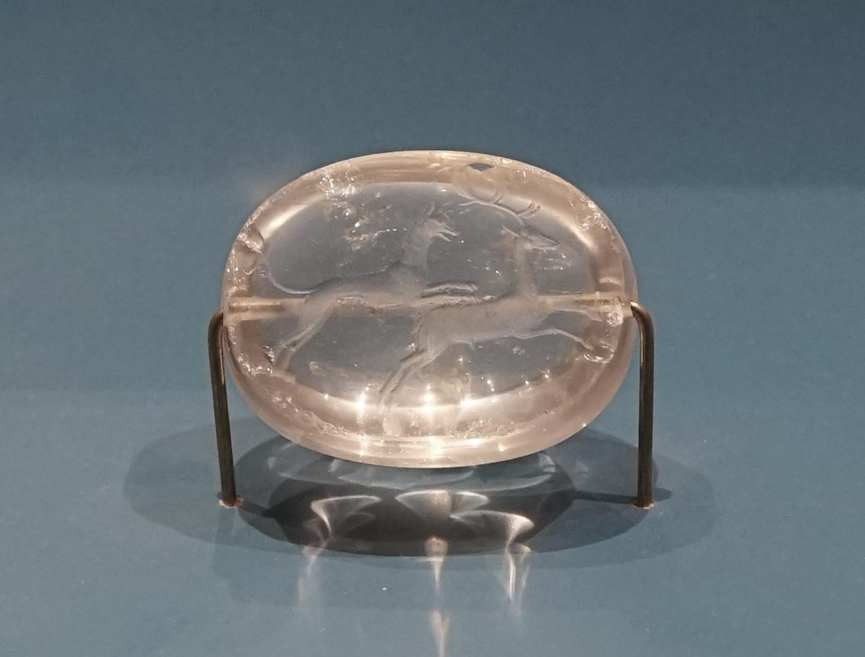 A rock crystal seal, bearing the image of a dog chasing a deer. Egnazia, Apulia, S. Italy, 3rd c. BCE. Now in MArTA museum in Taranto.jpg