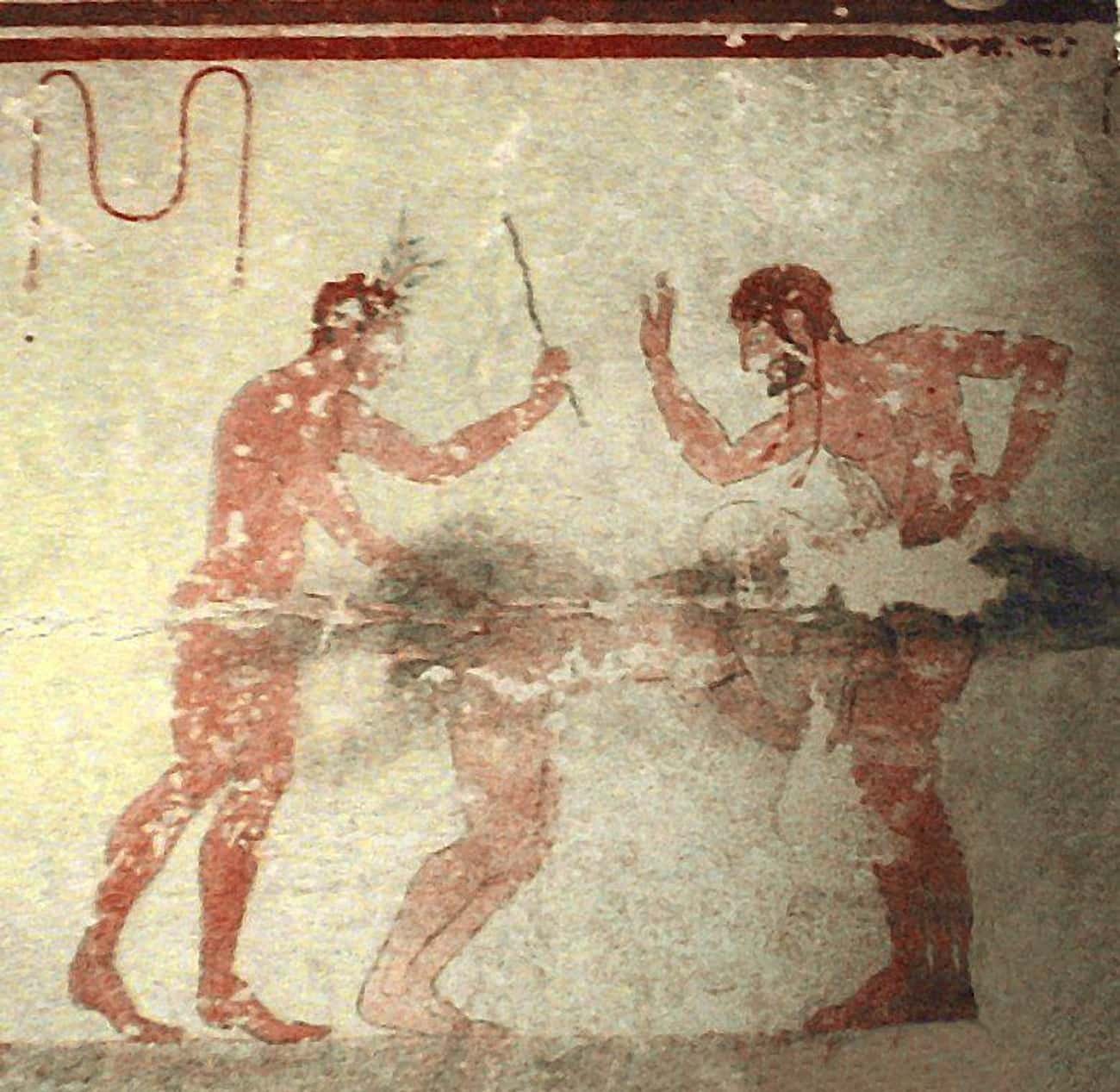 An Etruscan fresco, at the Tomb of the Whipping, showing two men flagellating a woman with a whip and a hand during an erotic situation. 490 BCE, Necropolis of Monterozzi, Italy.jpg