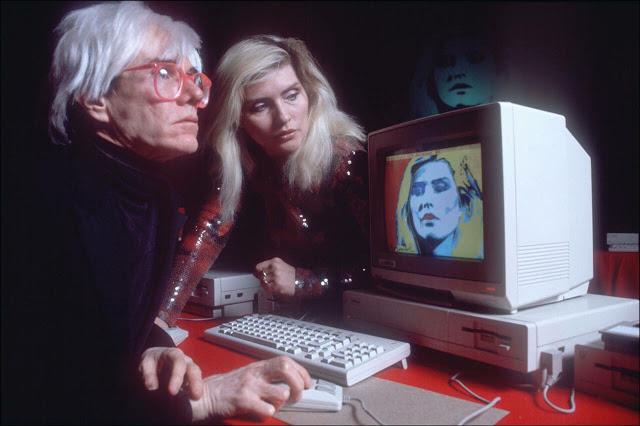 Andy Warhol making a digital painting of Debbie Harry using an Amiga 1000 - 1985.jpg