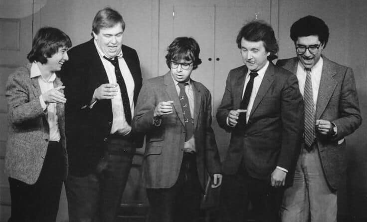 Martin Short, John Candy, Rick Moranis, Dave Thomas, and Eugene Levy on the set of SCTV, 1983.png