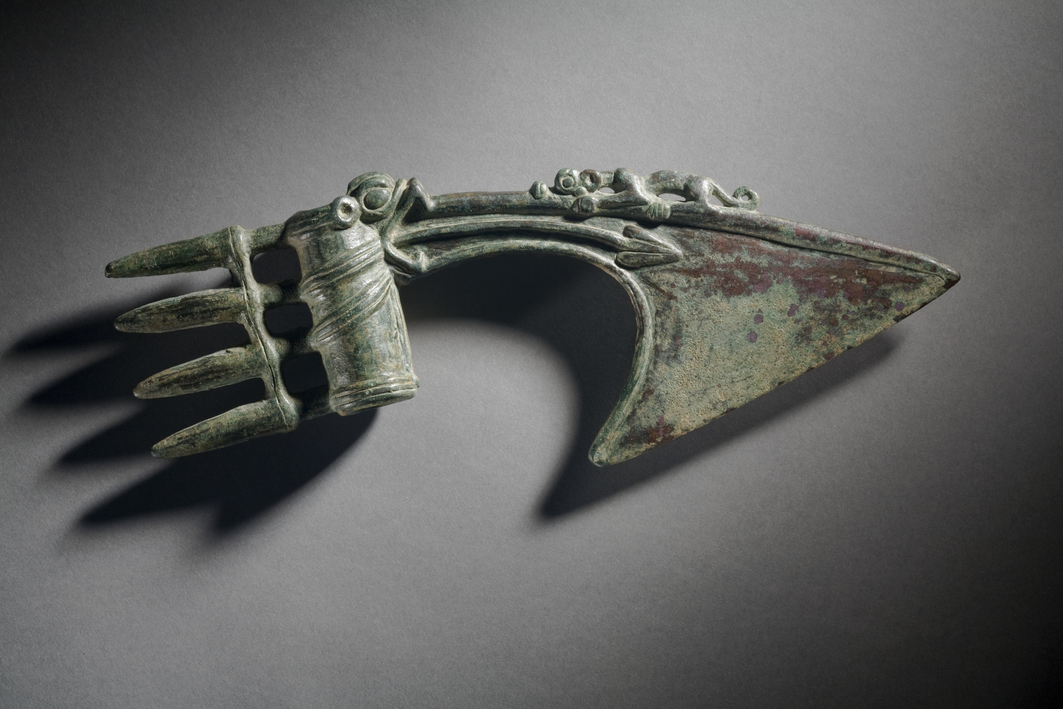 Iron Age axe-head with spikes, and a feline figure on top, made of bronze. Lorestan, Iran, 1350 - 1200 BCE. Classified in the so-called Luristan bronzes.jpg