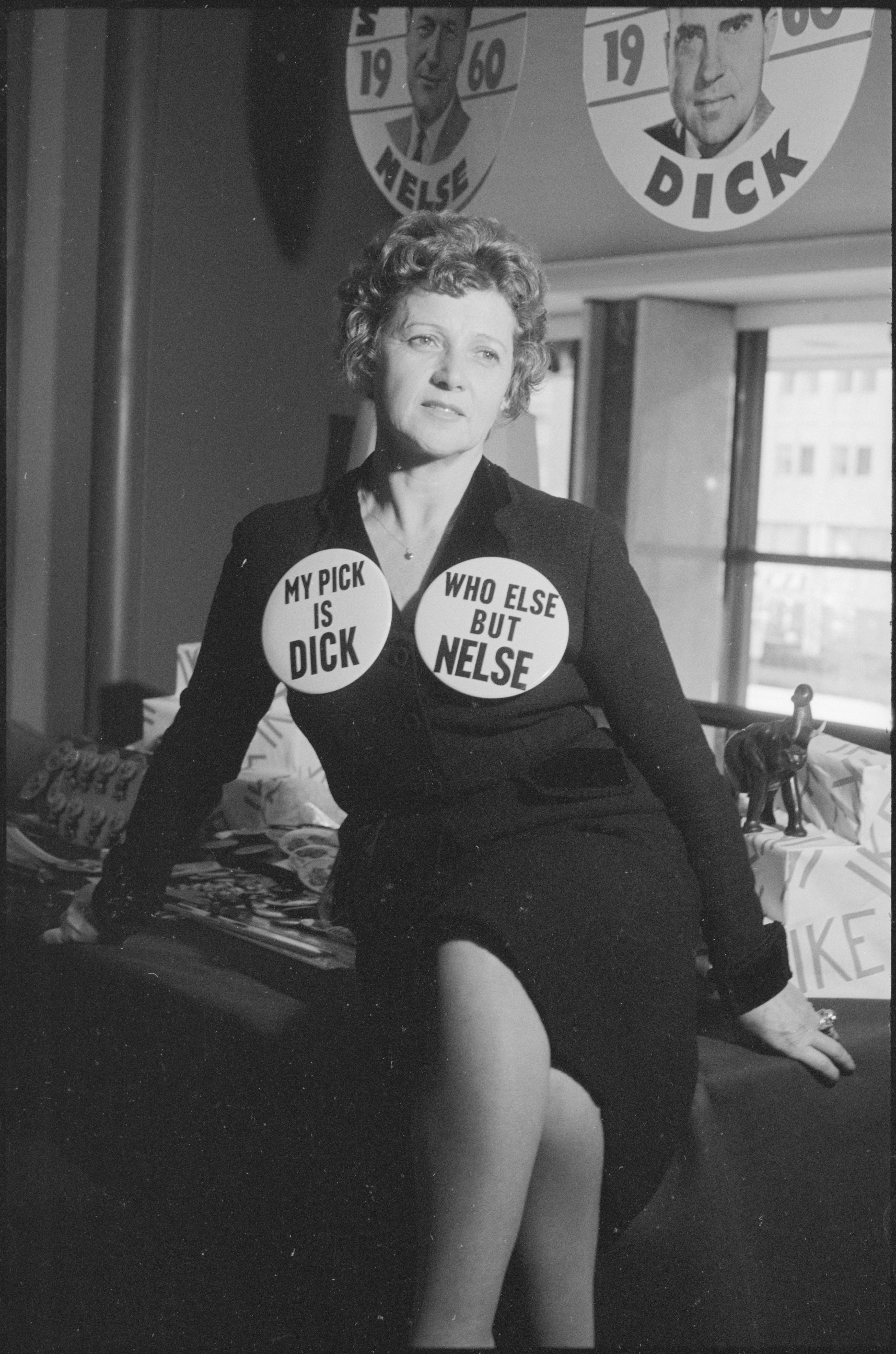 April 15, 1959. Woman wearing Republican Party buttons supporting Richard Nixon and Nelson Rockefeller.jpg
