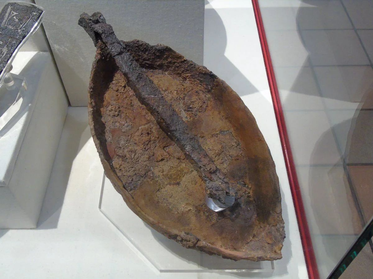 Roman military frying pan with foldable handle for easy storage and portability, made of iron, was used by a soldier to cook meals. National Legion Museum in Caerleon (Wales).jpg