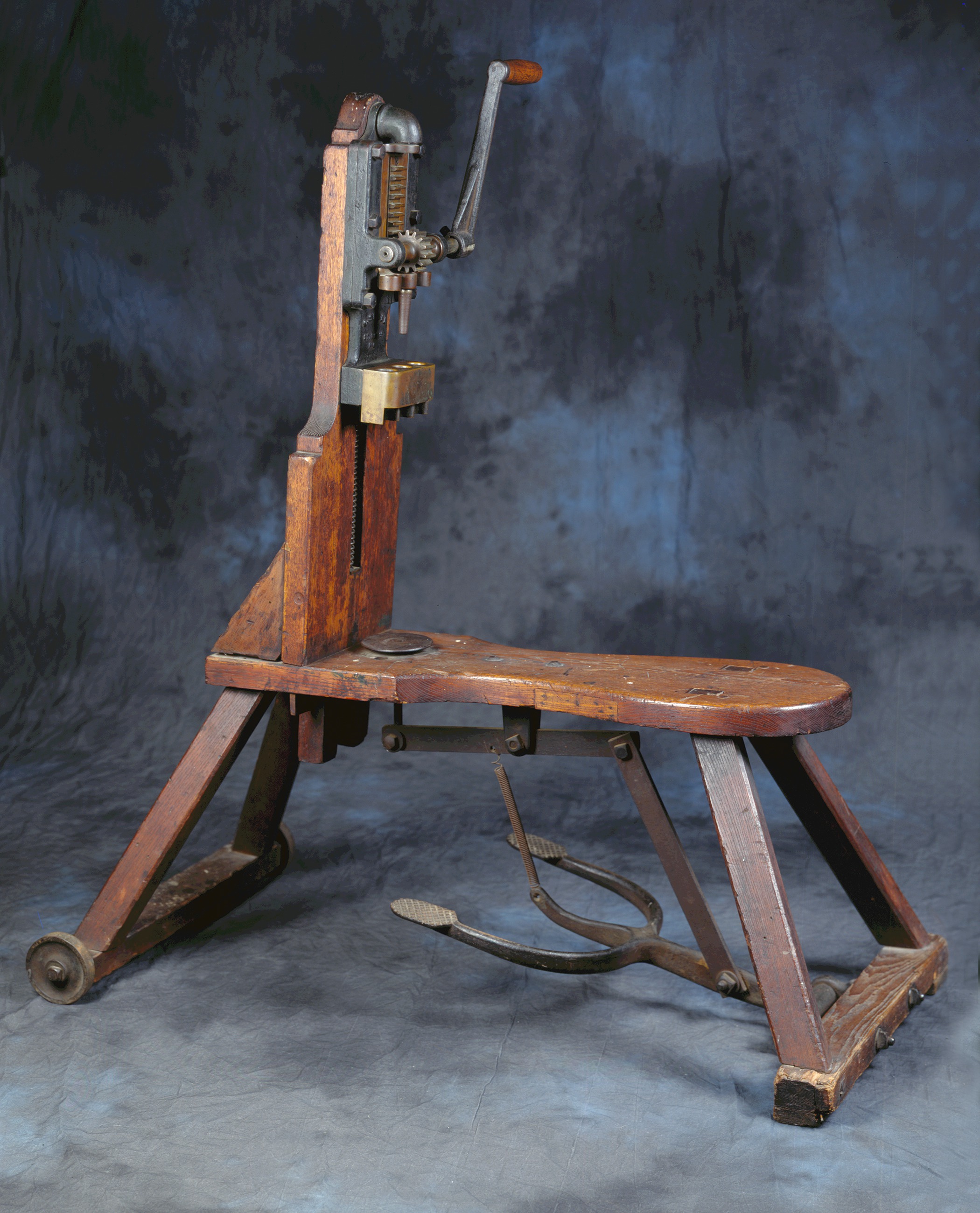Bottle corking machine used at the Adam Lemp brewery in St. Louis, Missouri, c. 1870 - operator's seat, hand lever attached to various size cork holders, and foot mechanism to lift the bottle up to the cork.jpg