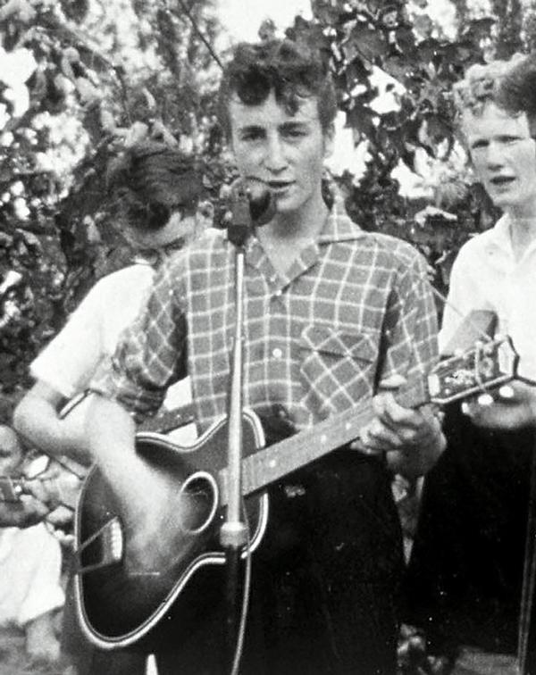 A teenage John Lennon in 1957 performing with the Quarrymen.jpg