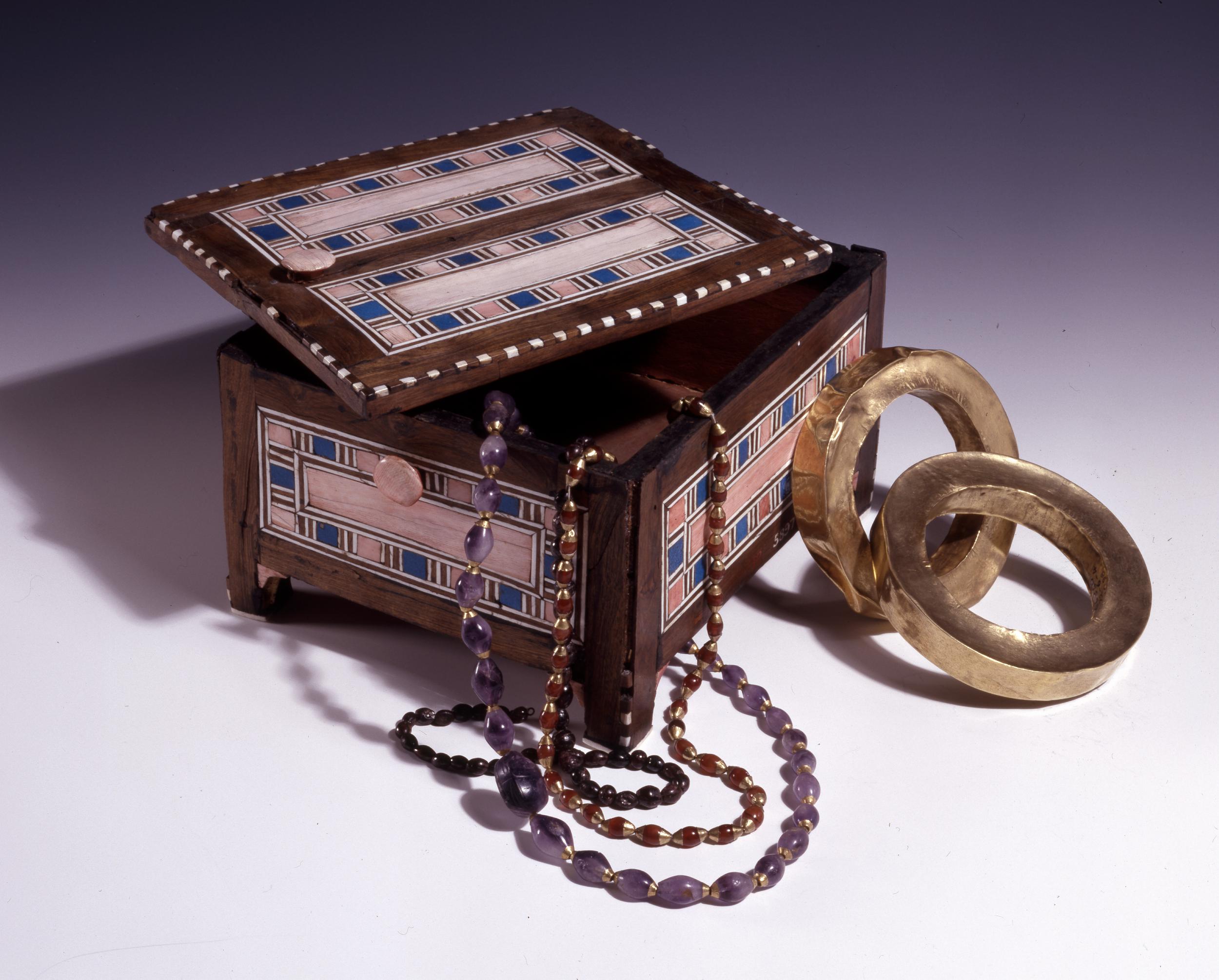 Cosmetic box. 18th Dynasty. Egyptian. Ebony, pink-stained ivory, and faience. (ca. 1549 to 1292 BC).jpg