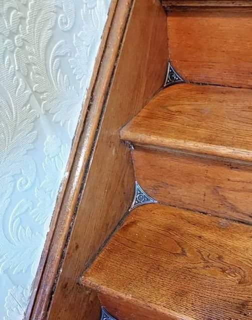 Stair dust corners, introduced in the late 19th century, prevent dust in stair corners.jpg