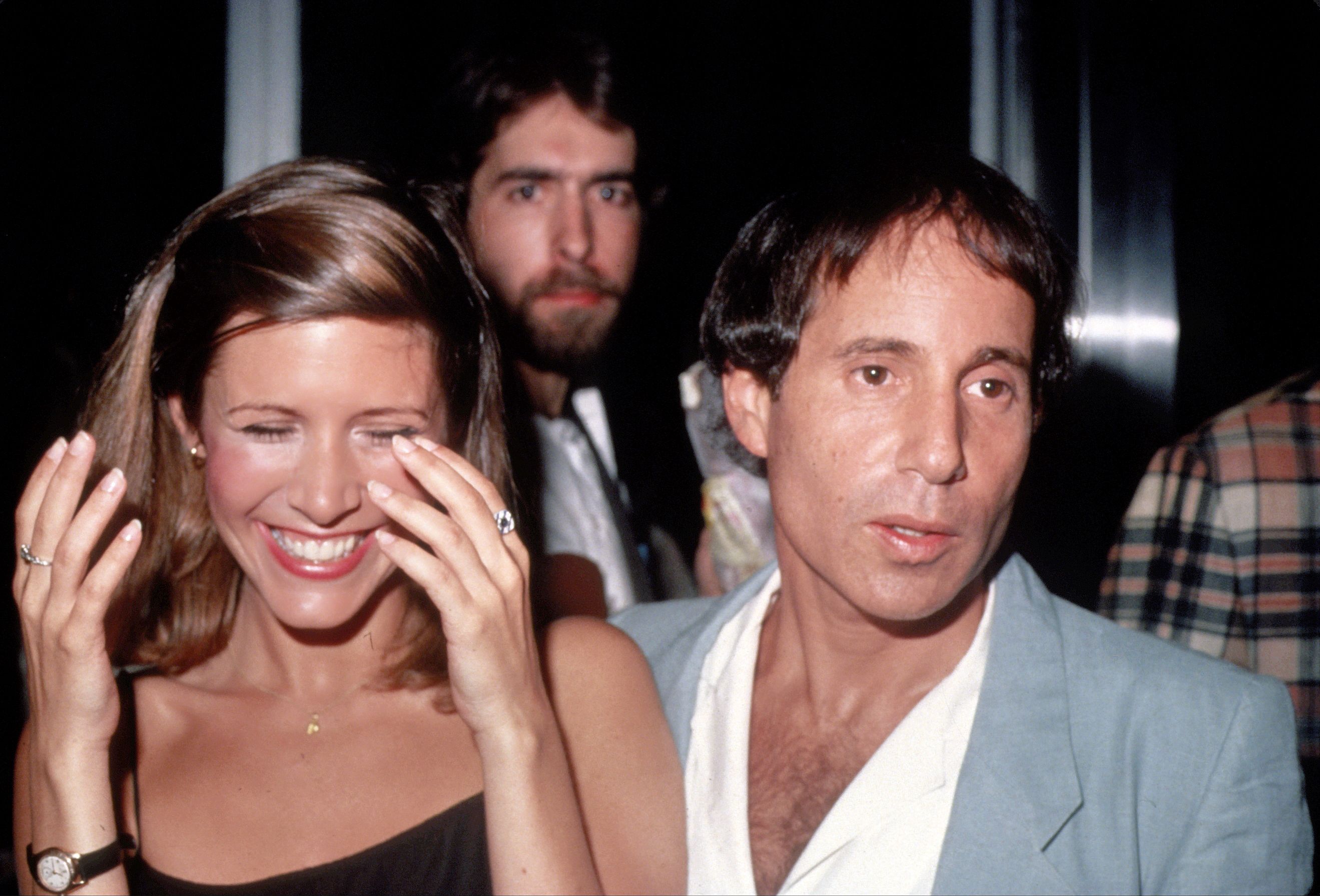 Paul Simon and Carrie Fisher 1983.jpg