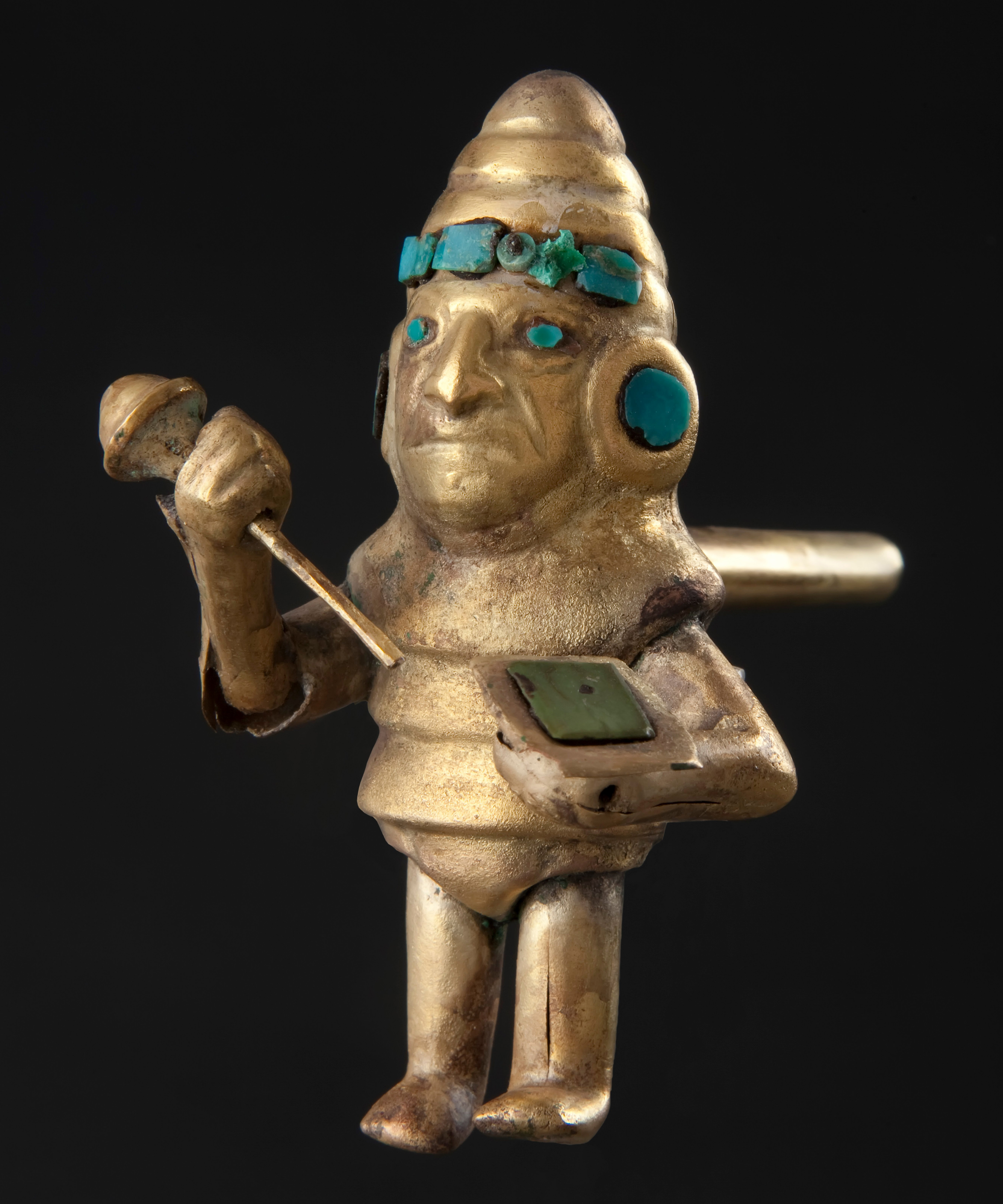 Gold and turquoise whistle shaped like a warrior with club and helmet. Peru, Moche civilization, 1-800 AD.jpg