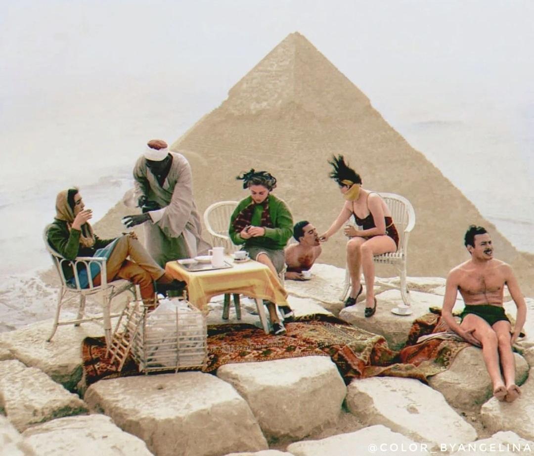 Tourists having refreshments and sunbathing at the top ofthe great pyramid, 1938.jpg