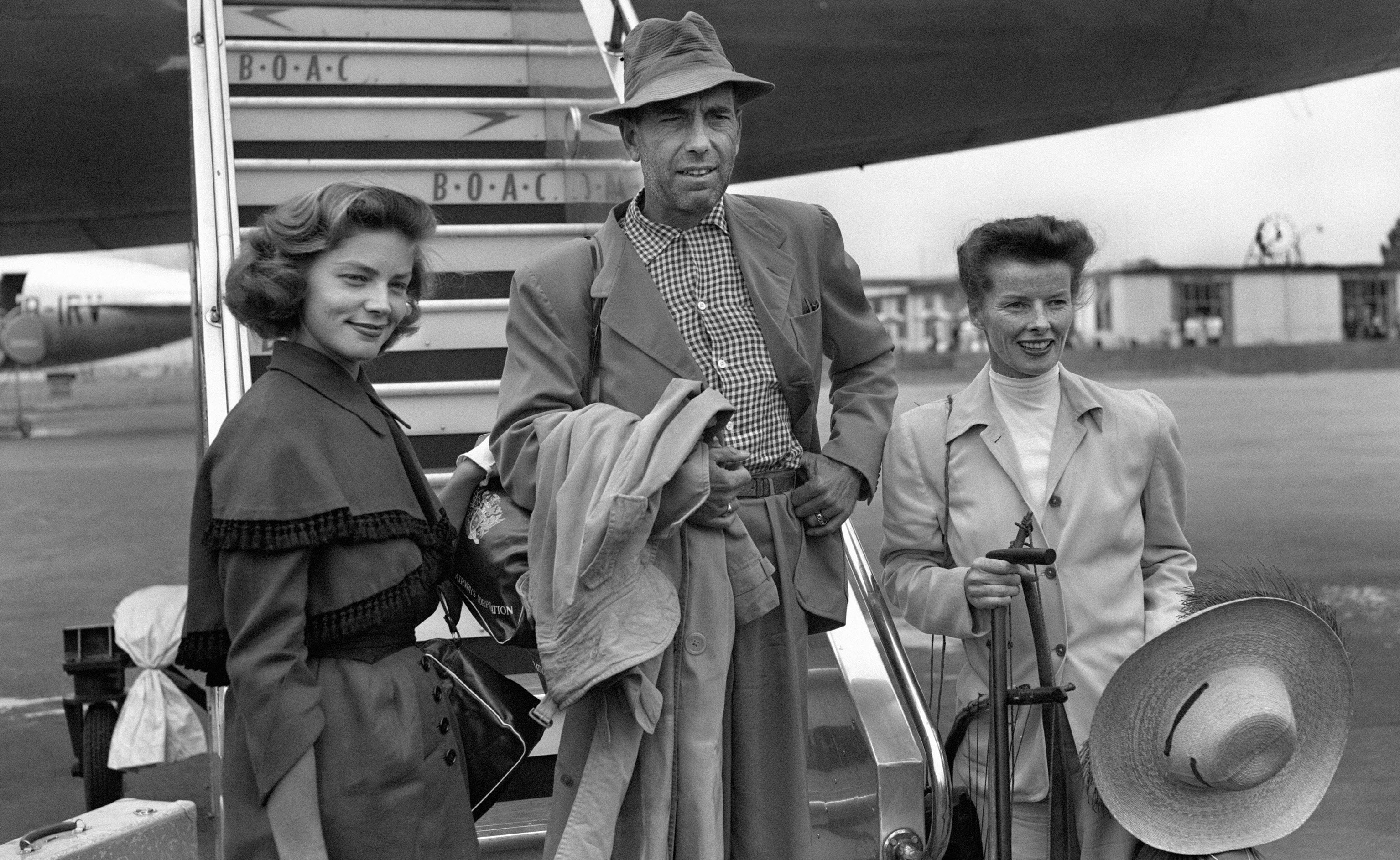 Lauren Bacall with Humphrey Bogart and Katharine Hepburn at London Airport after arriving from filming The African Queen, 1951.jpg