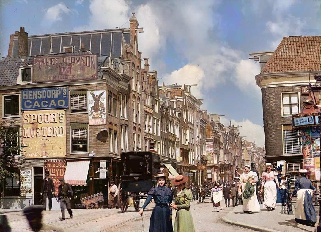 A view looking down Utrechtsestraat in Amsterdam, the Netherlands, 20 July 1898, by Jacob Olie. Standing at the foregroundare two sisters named Christiene and Marietje Bouchier. Credit  - retrograde_colour on Instagram.jpg