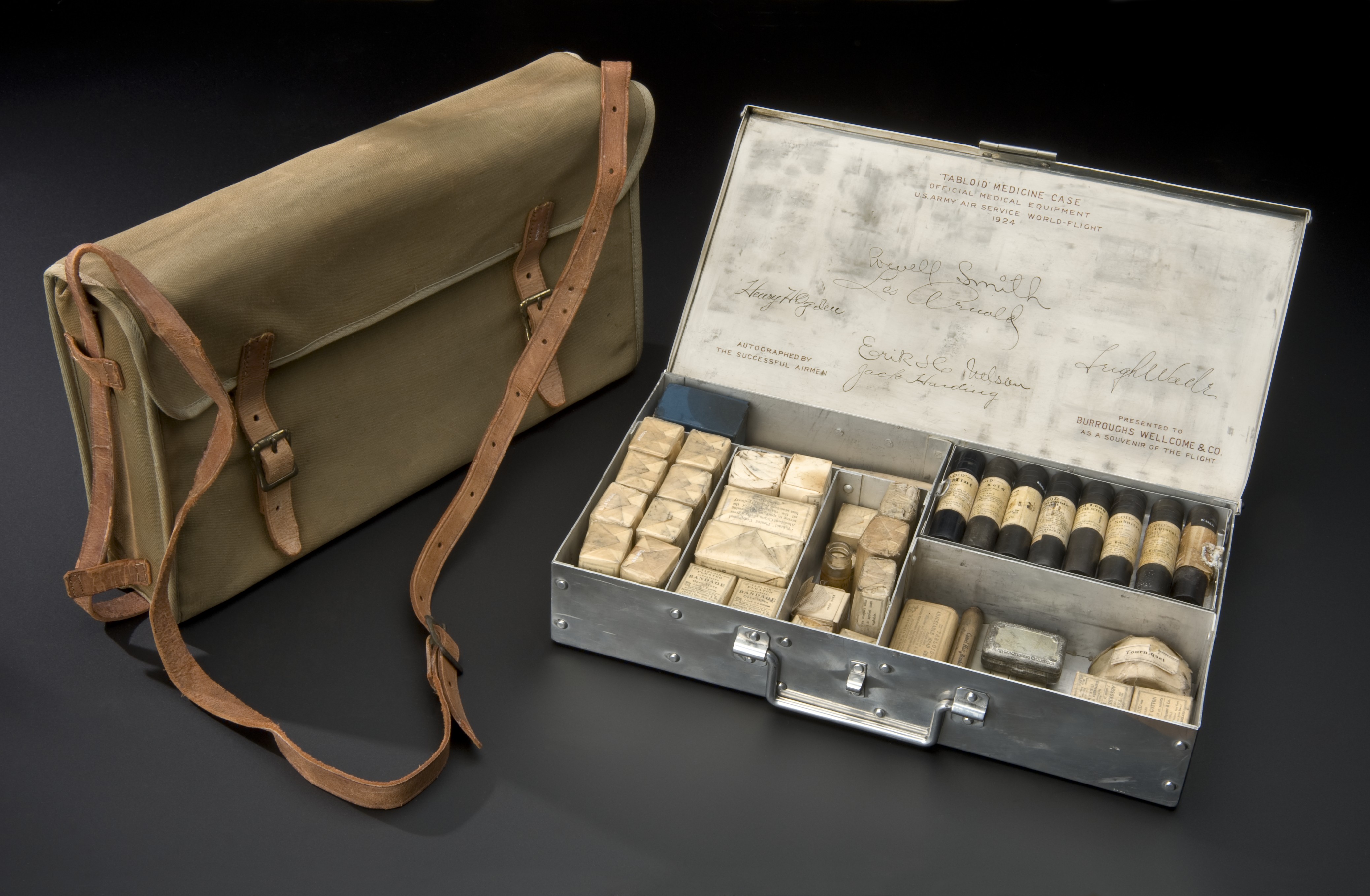 Tabloid brand first aid kit with aluminum case and canvas satchel used on the U.S. Army Air Service around-the-world flight of 1924.jpg