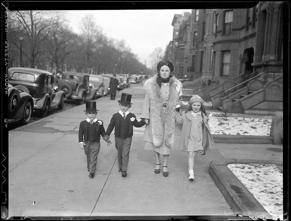 Woman walking with three children , Boston 1930.jpg