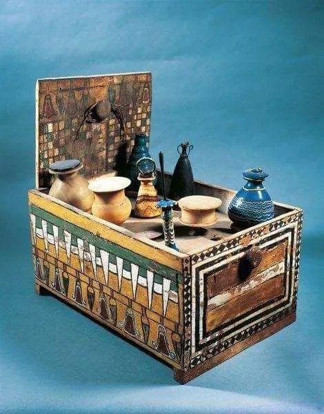 Egyptian Decorated Box of Flasks and Jars, used for holding fragrances and cosmetics from the tomb of Merit, wife of royal architect Kha, around 1400 BC..jpg