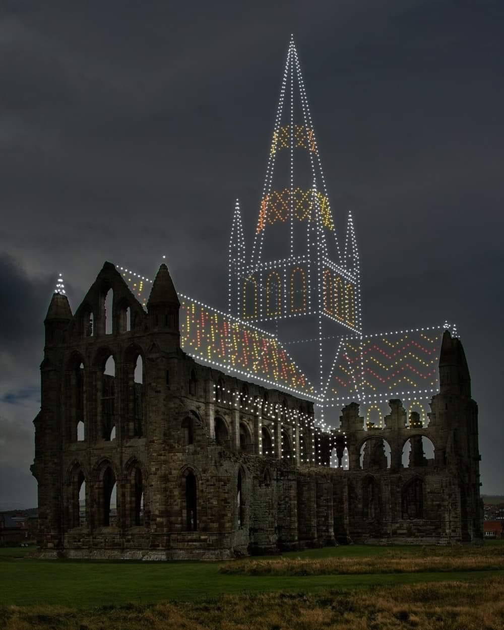 The ruins of Whitby Abbey in North Yorkshire completed by drone lighting.jpg