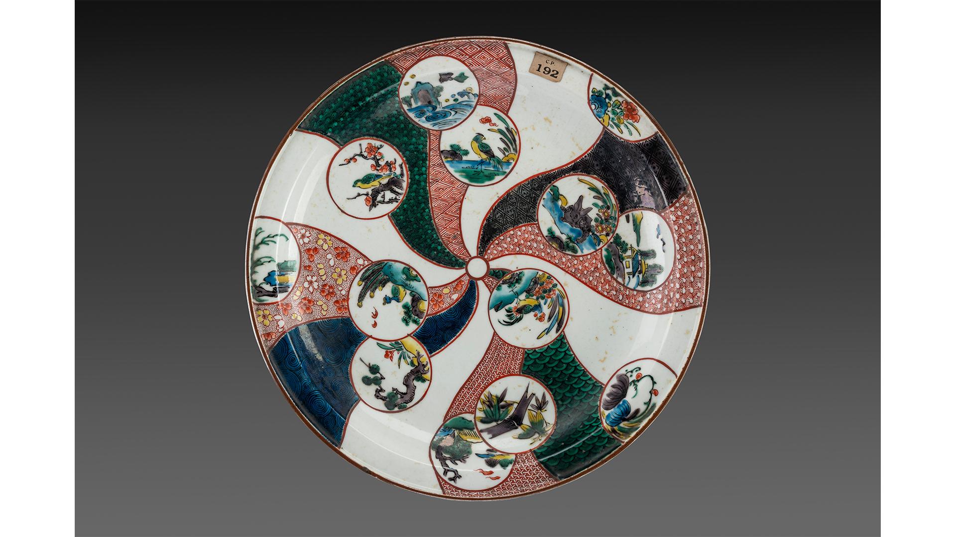 Kutani porcelain plate decorated with birds and peony design in green,19th century, Japan on display at csmvs museum Mumbai India.jpg