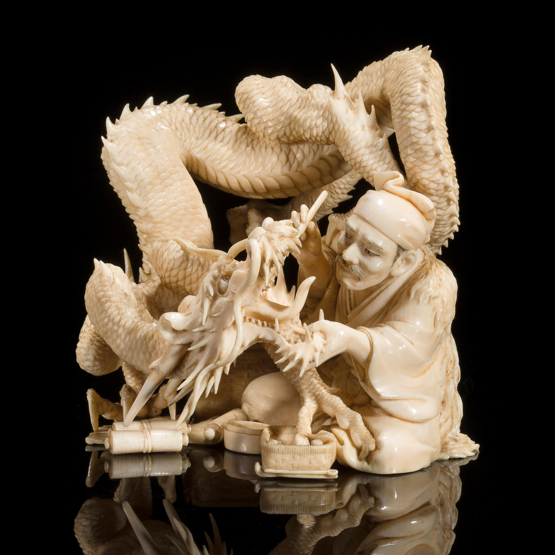 Ivory carving of a dentist treating a dragon. Japan, Meiji period, 19th century.jpg