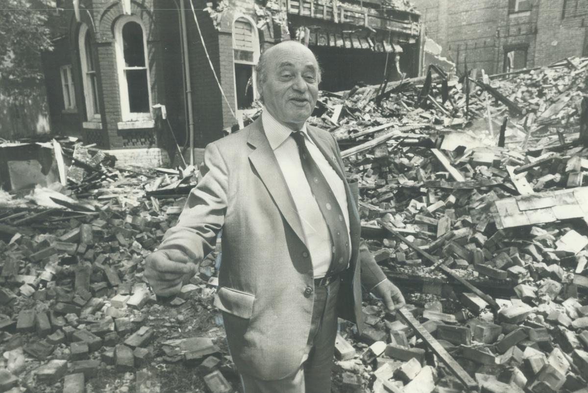 Communist party Leader William Kashtan, 70, stands in the wreckage of his party's national headquarters destroyed in a fire, 24.06.1980.jpeg