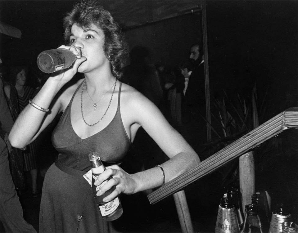 Double-fisting Miller High Life at the Boston nightclub Faces in 1977.png