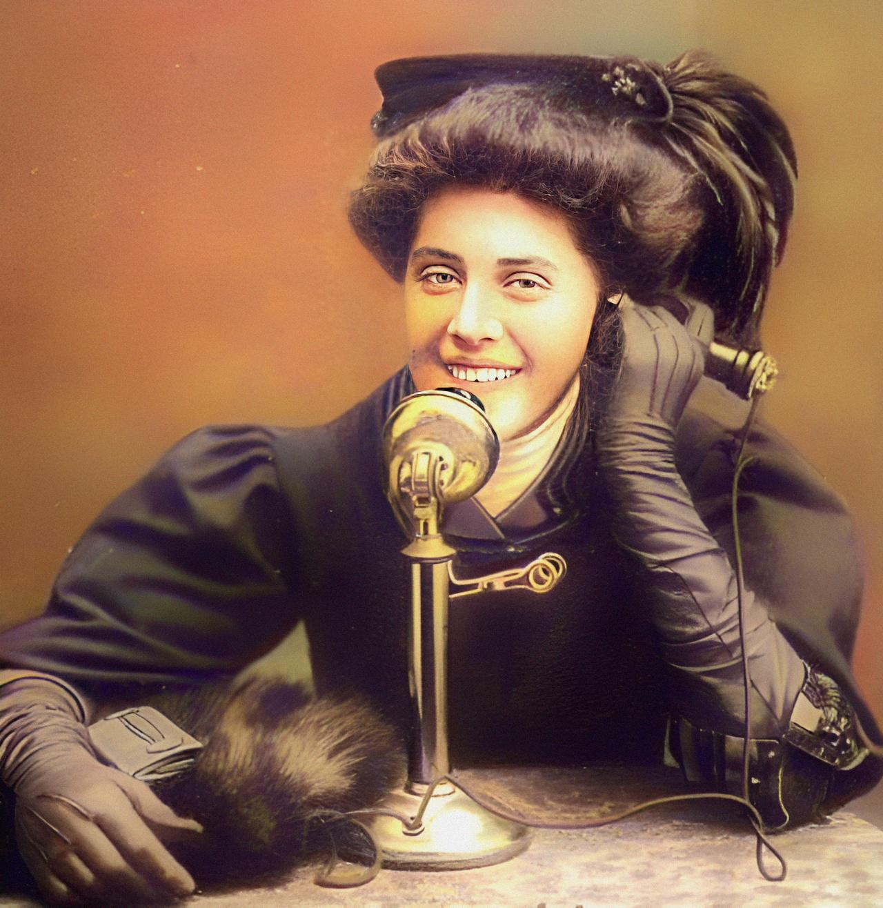 Lady talking on the telephone, ca. 1900.jpeg