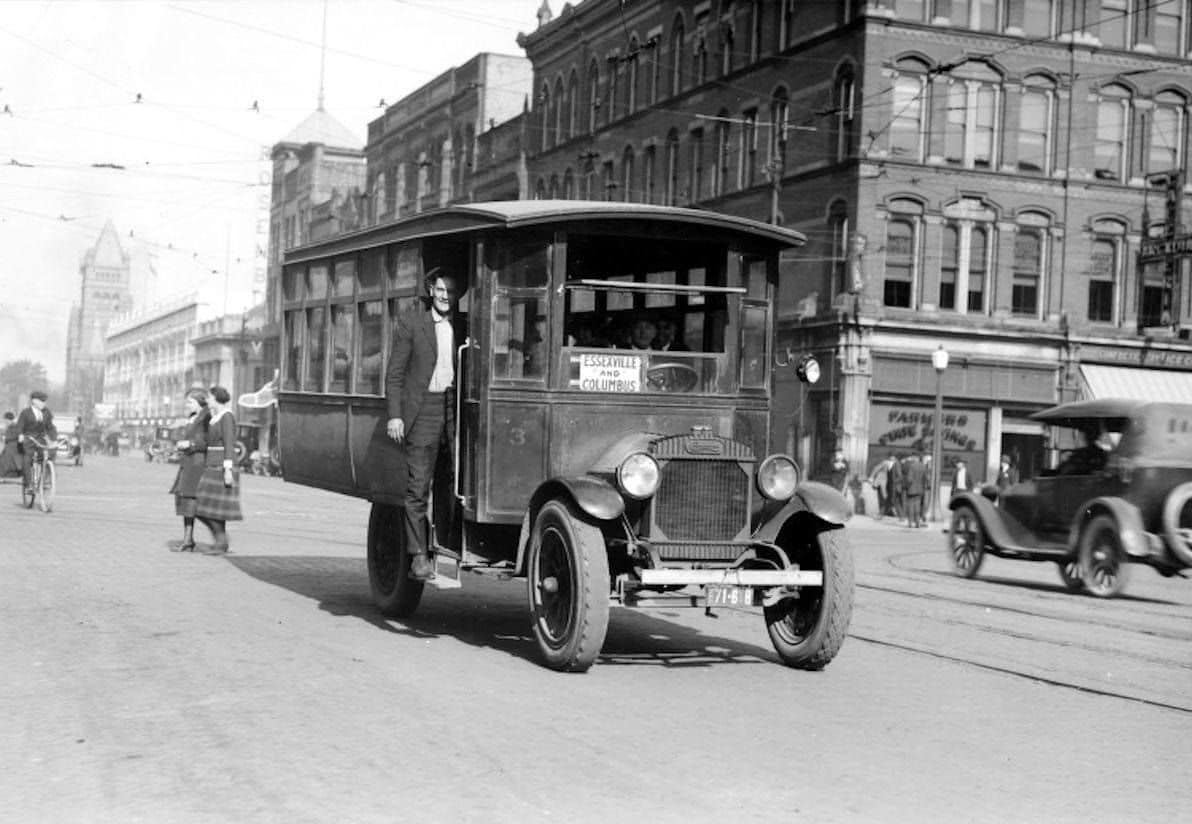 Bay City, MI bus passenger posing as they got on, 1920s.png