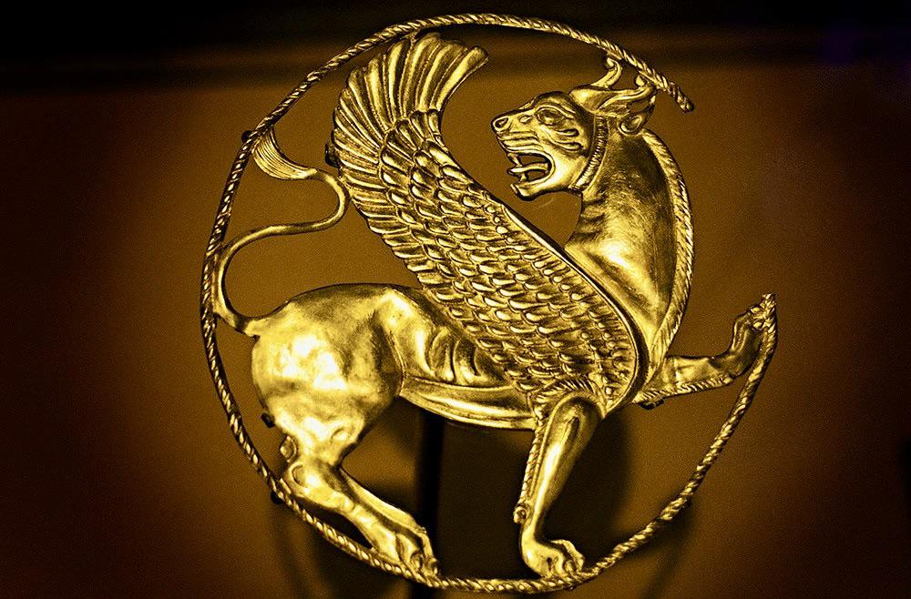 Achaemenid gold ornamental roundel from the reign of Artaxerxes II, featuring a characteristic Persian winged lion, 4th-5th Century BC.jpeg