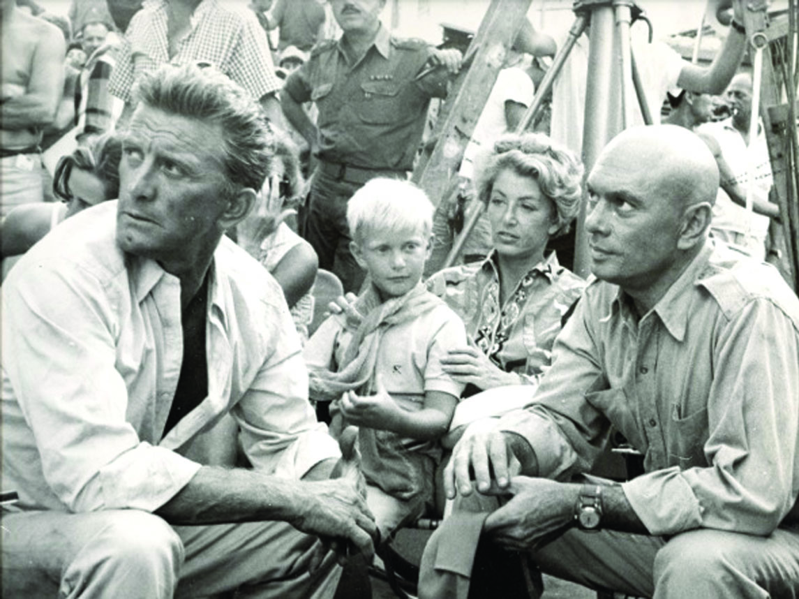 On the set of Cast a Giant Shadow. Kirk Douglas, son Eric, 8, Anne Douglas, and actor Yul Brynner. Israel , 1966.jpg