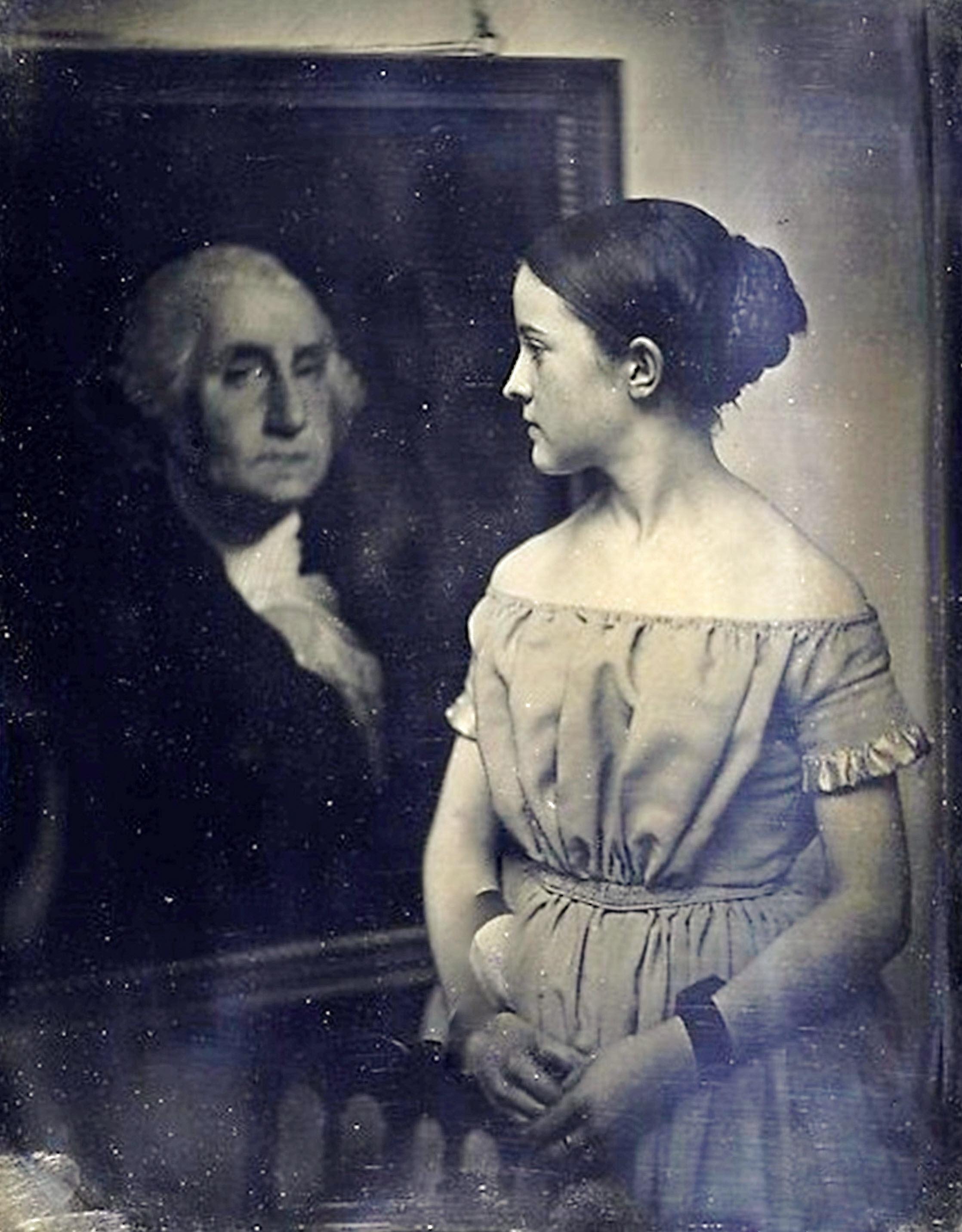 Girl with portrait of George Washington, early 1850s.jpeg