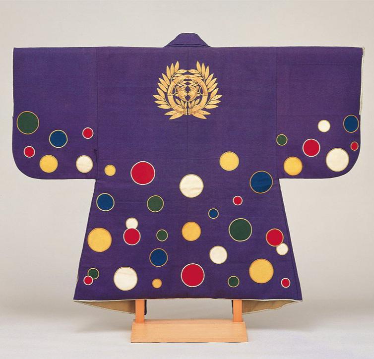 A violet wool jinbaori (armour surcoat) with roundels in five colors. Middle Edo period, 18th century CE, now housed at the Sendai City Museum in Japan.jpeg