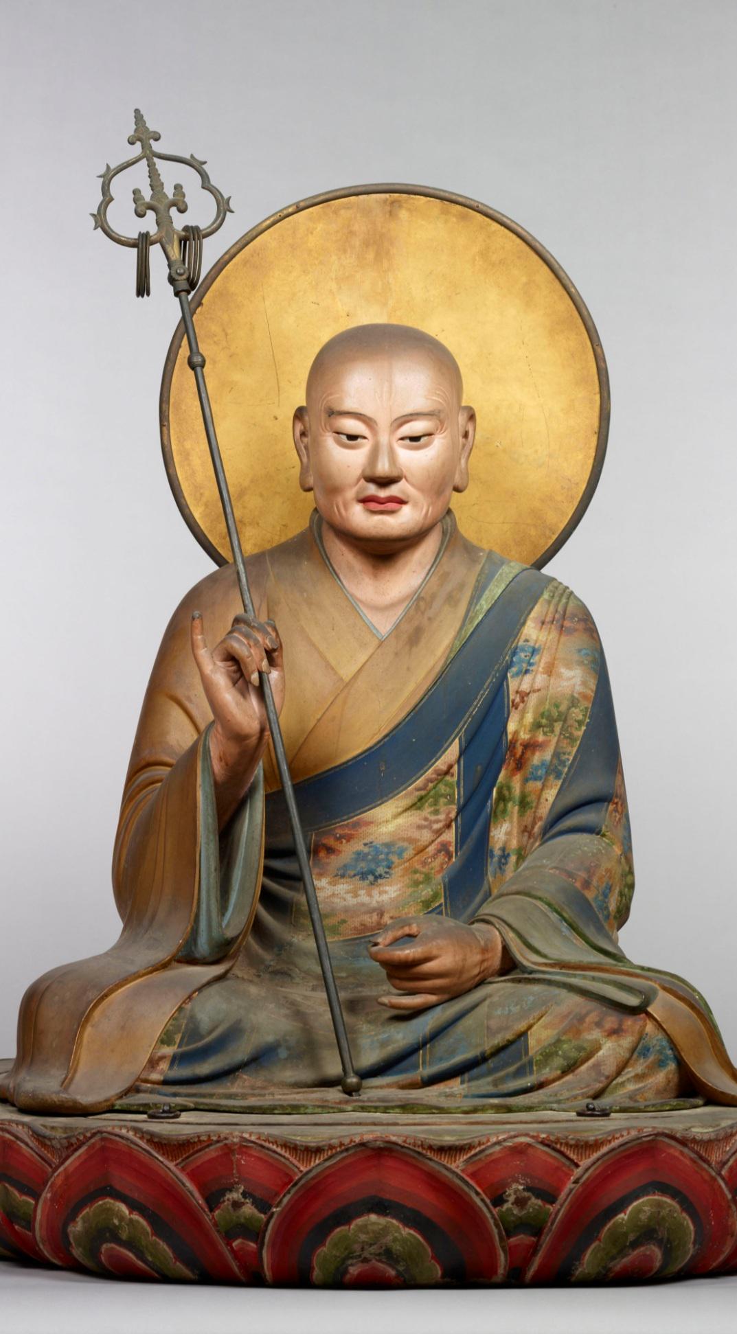 A painted wooden statue of the Shintō deity Hachiman, often referred to as the god of war. Made by the sculptor Kaikei in 1201 CE. Kamakura period, now housed at the Tōdai-ji temple in Nara, Japan.jpeg