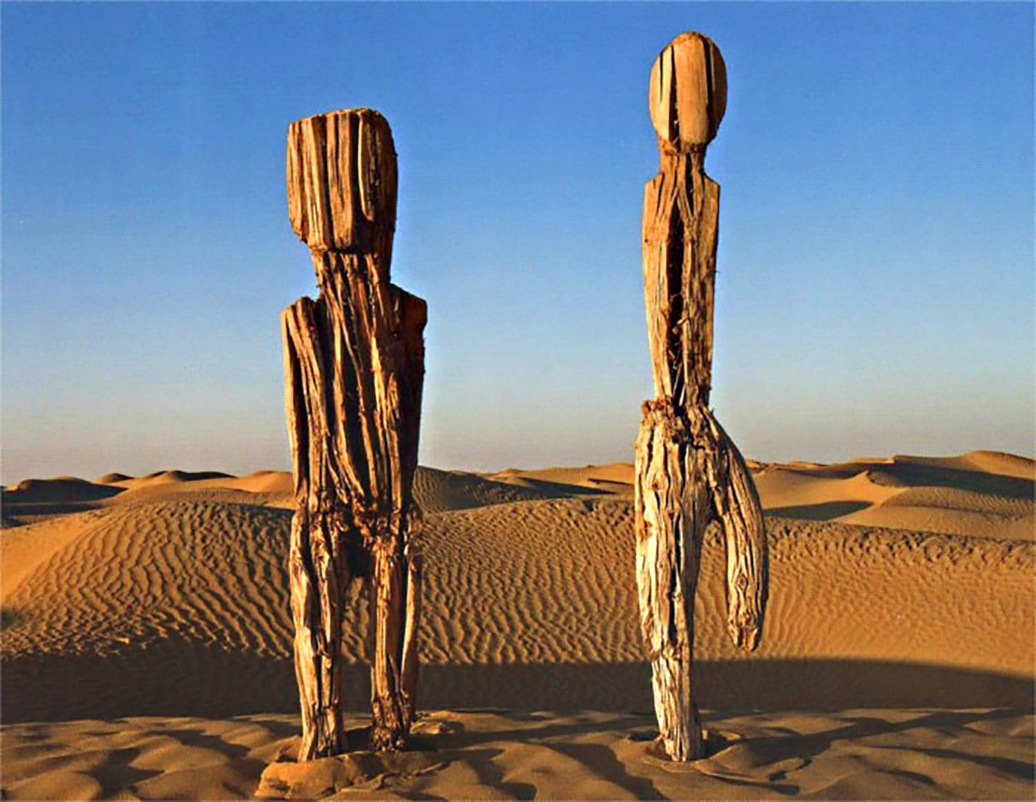 4000 year old wood-carved figures in the lost Desert Cemetery of Xiaohe China.jpeg