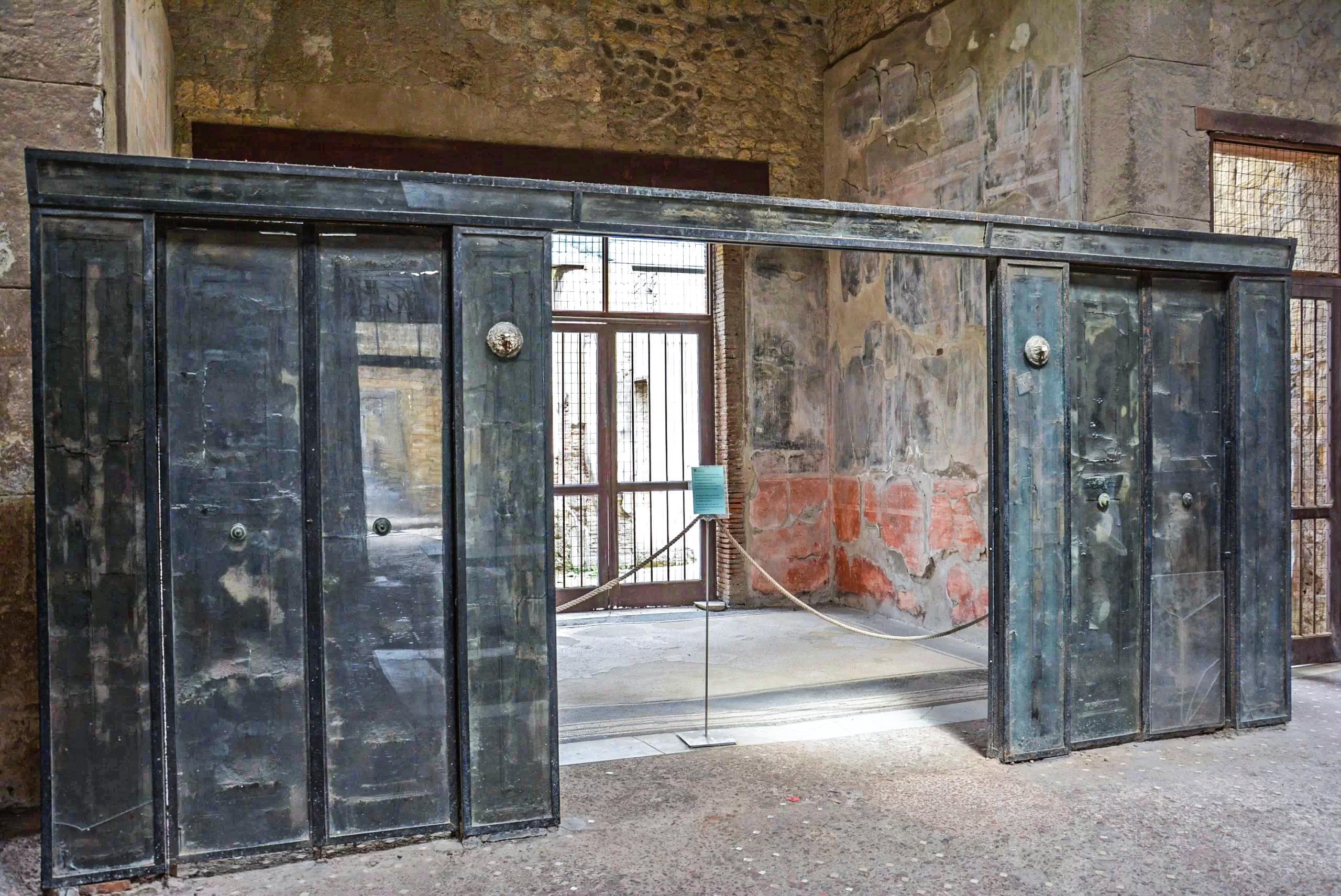 The sliding wooden doors that partitioned off the office or study (tablinum) of a Roman townhouse from the hustle and bustle of the main atrium.jpeg