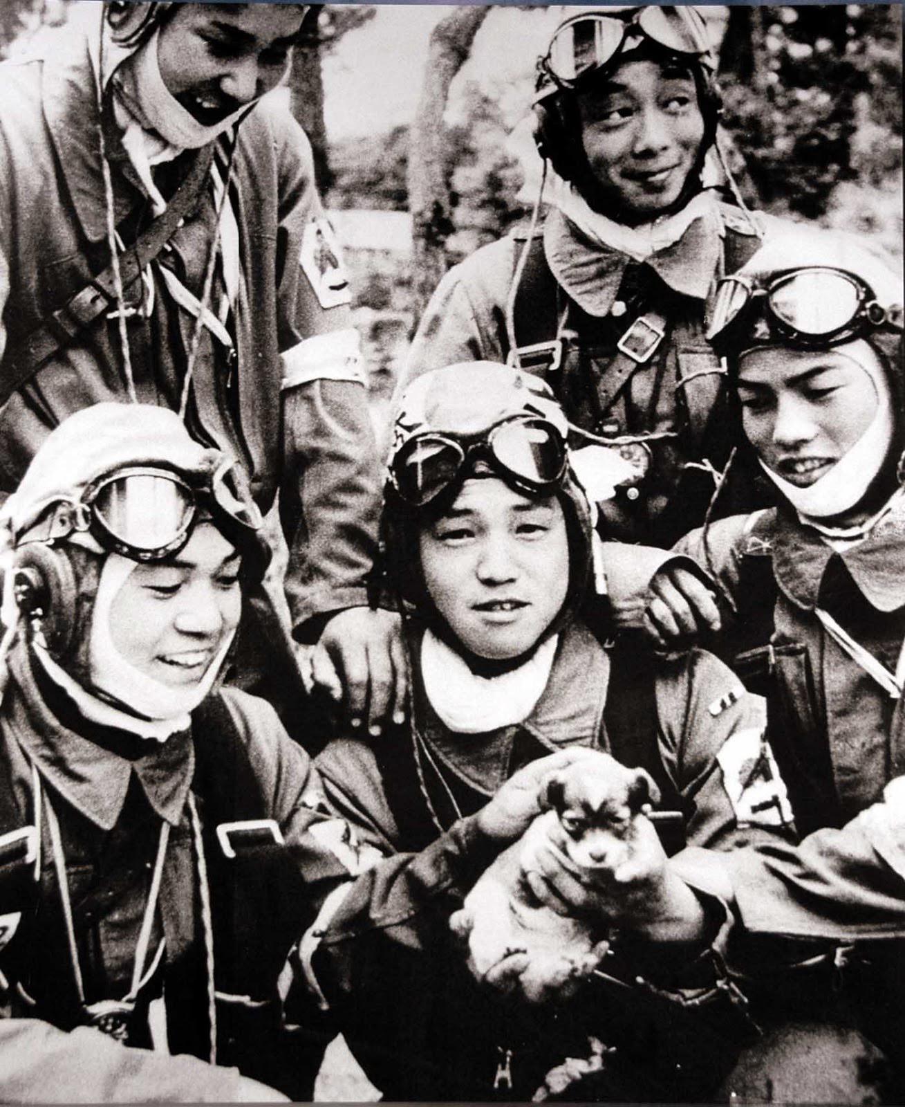 Japanese kamikaze pilots pose with a puppy before their final suicide mission in Okinawa, 1945.jpeg