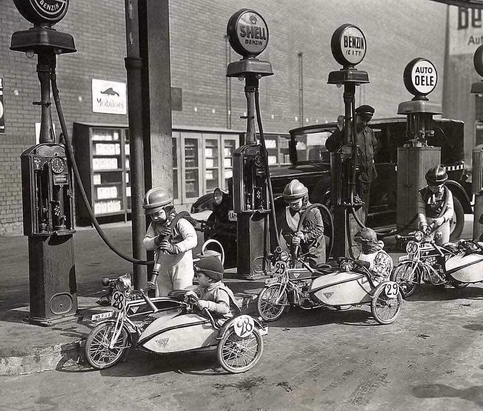 Riders refuel during a children's sidecar race in Berlin, Germany, 1931.jpeg