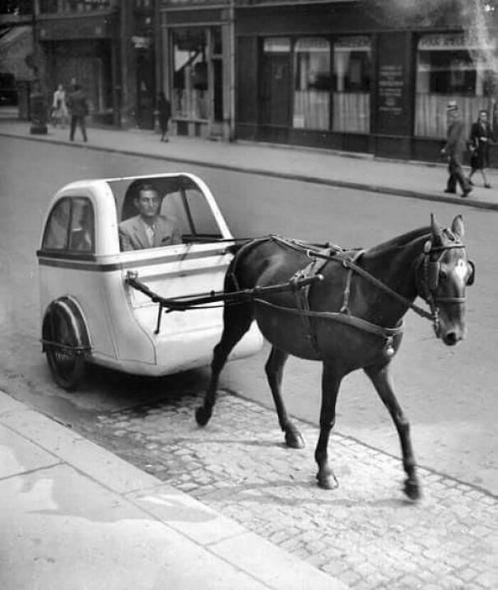 An Ultra Light Horse-Drawn Car In Traffic Paris (1943).jpg