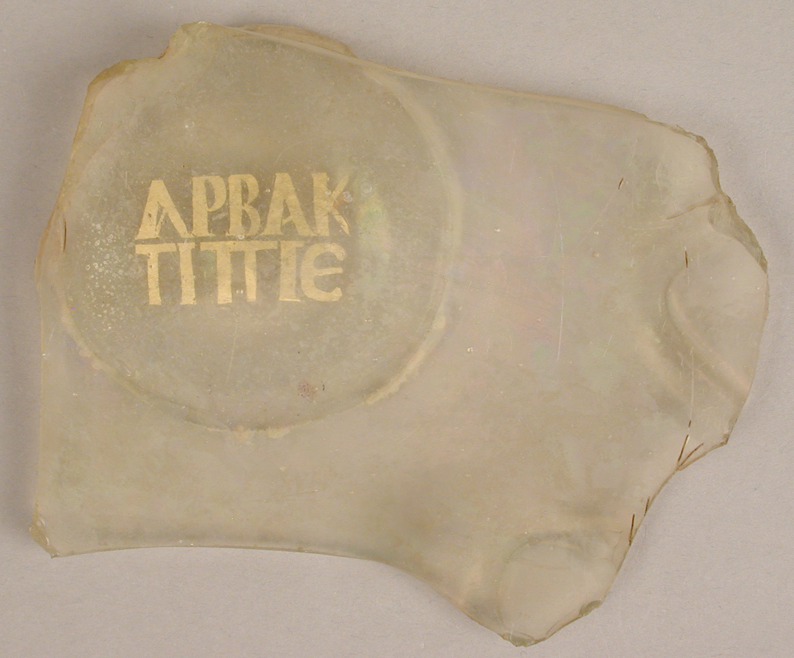 Ancient Roman glass bowl fragment with gold leaf lettering, c. 3rd century CE..jpg