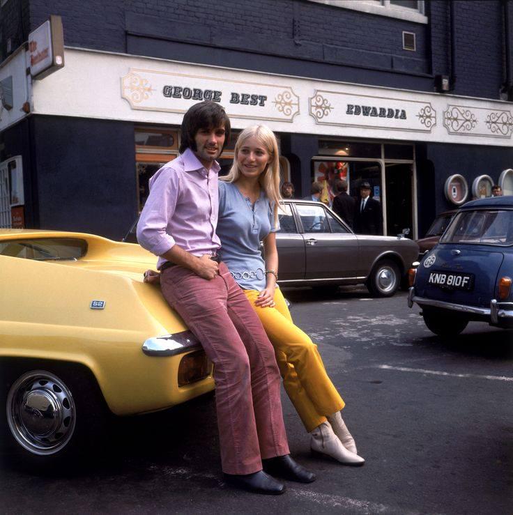 Manchester United footballer George Best and his fiancée Eva Haraldsted outside his clothing boutique on Manchester's Bridge Street, 1969.jpeg