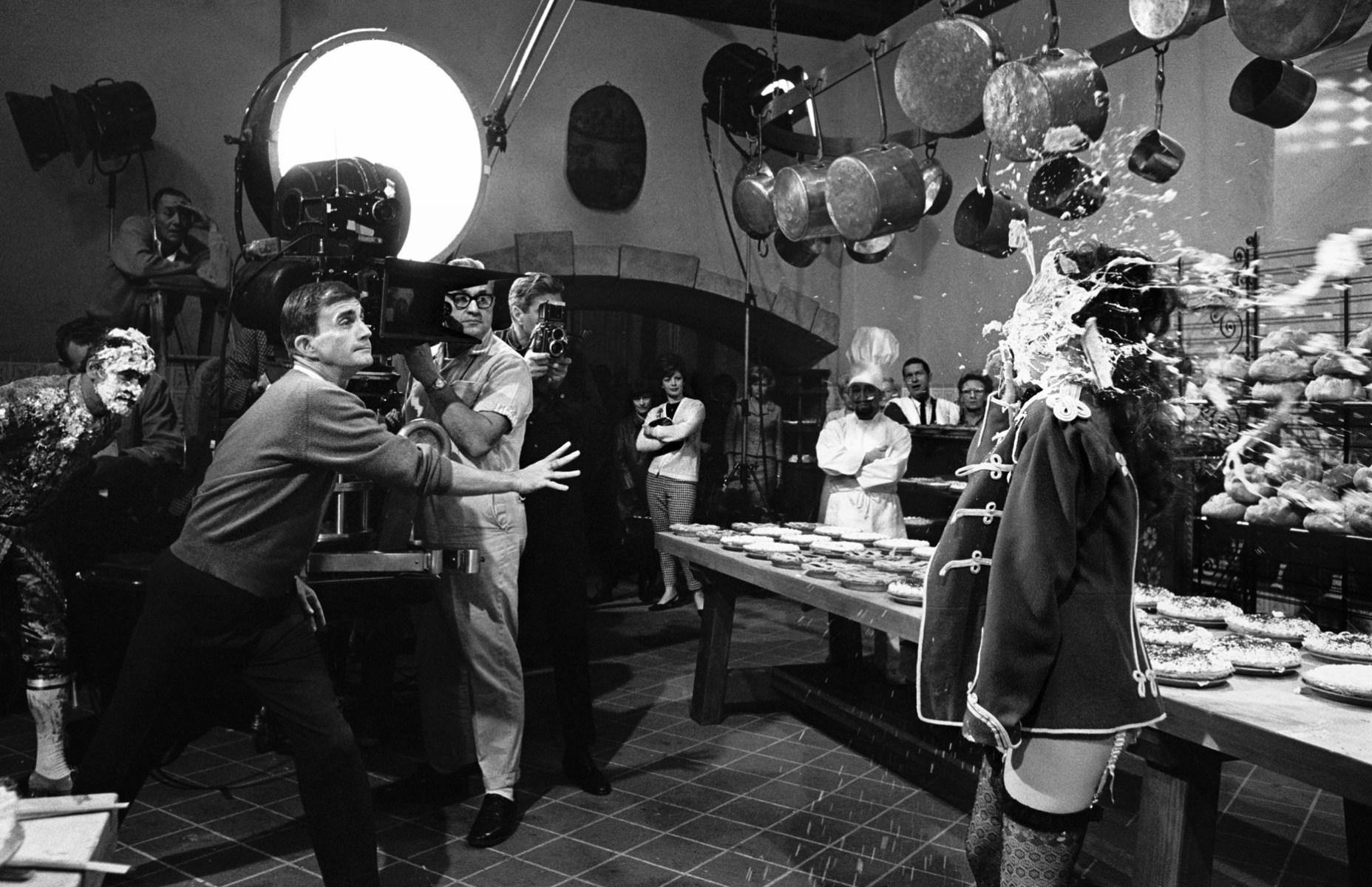 Director Blake Edwards throws a pie right in the face of actress Natalie Wood, during filming of The Great Race (1965).jpeg