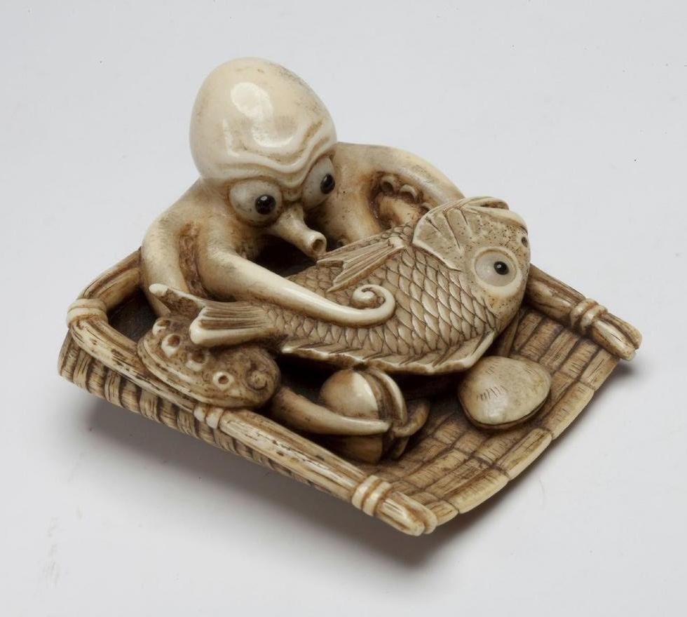 Ivory carving of an octopus with basket of sea bream, clams, and abalone. Japan, 19th century.jpeg
