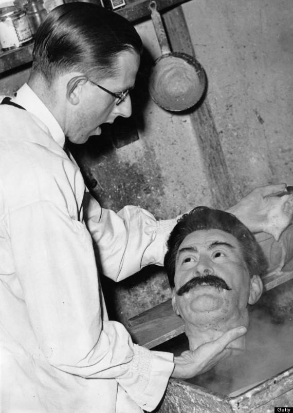 The wax head of Joseph Stalin being cleaned at Madame Tussauds, Circa 1930..jpeg
