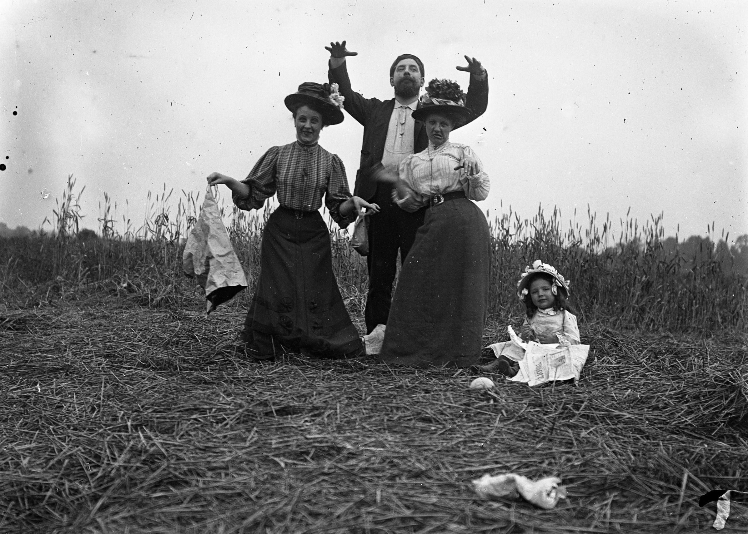 Family lunch in a field. France 1900s. Glass Negative.jpeg