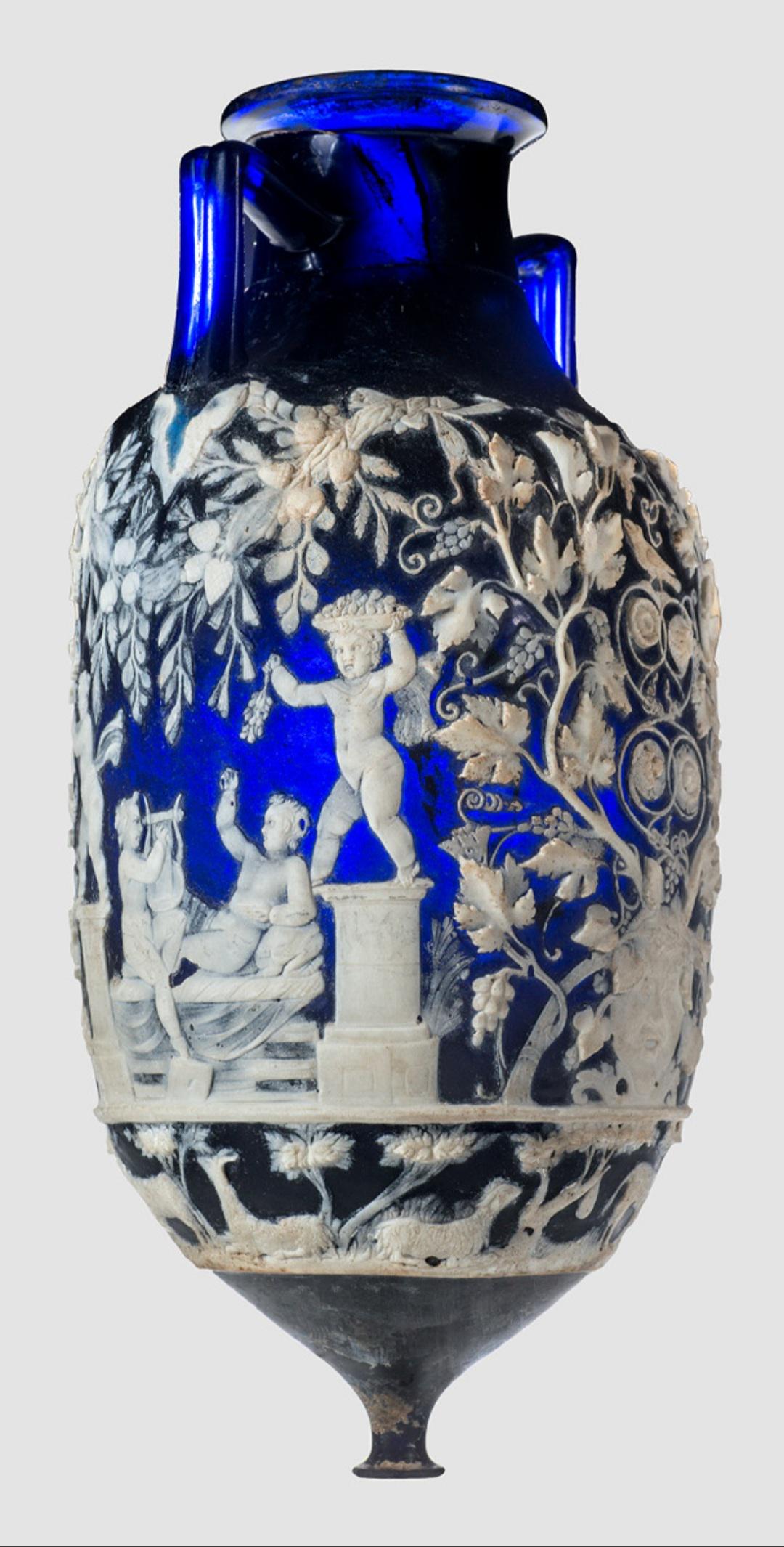 A cameo glass amphora decorated with scenes of Cupids harvesting grapes. Ca. 1st Century CE, from the Tomb of the Blue Vase in Pompeii, now housed at the National Archaeological Museum of Naples.jpeg