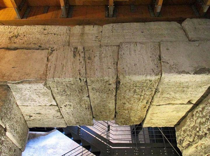 Flat arches with 'hanging' masonry supporting the arena floor of the Colosseum. Laid upon a frame that was then removed, the central keystone has held the bricks in place since the 1st century CE.jpeg