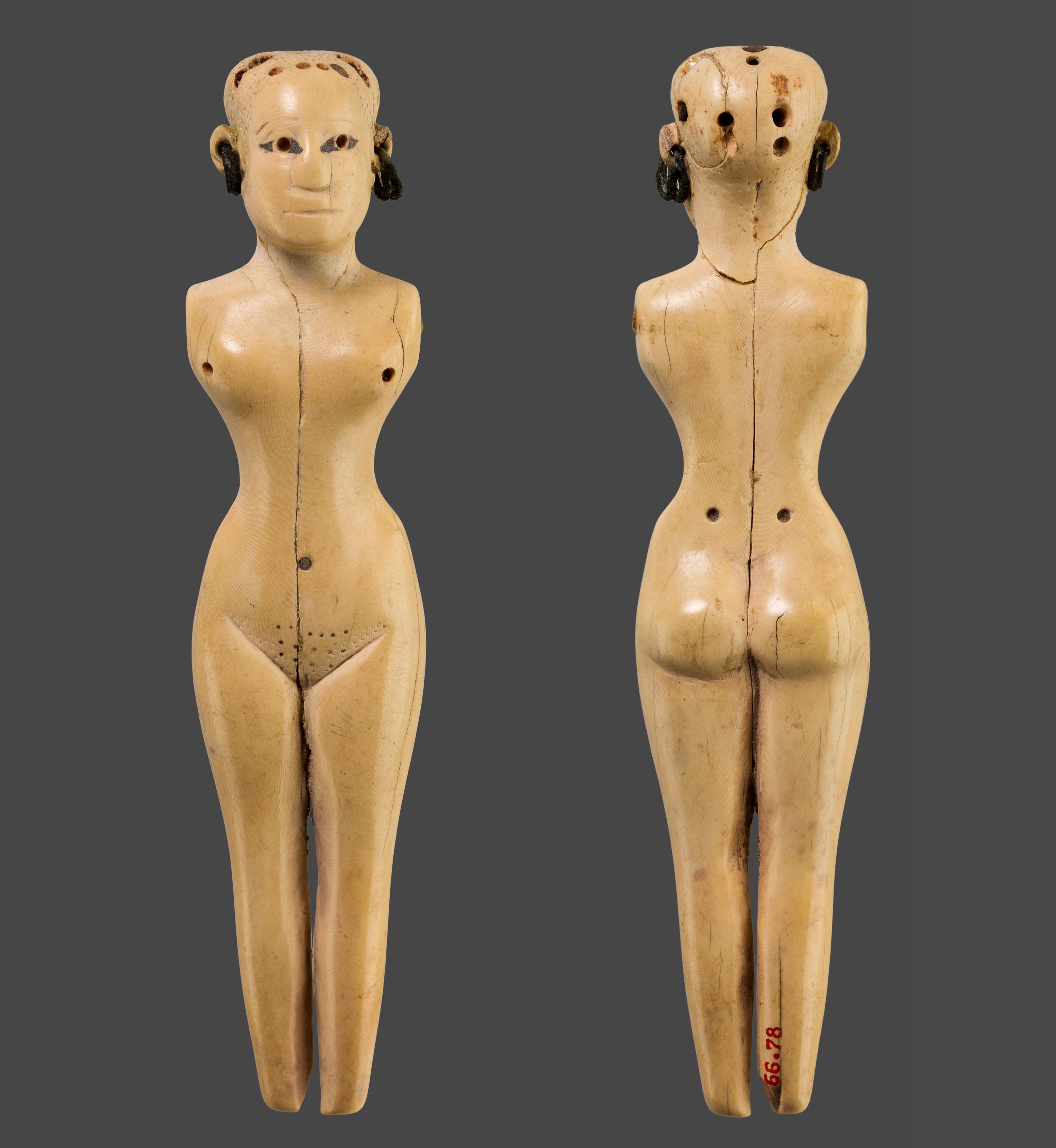 Ivory figurine of a woman with earrings. Egypt, 1981–1550 BC.jpeg