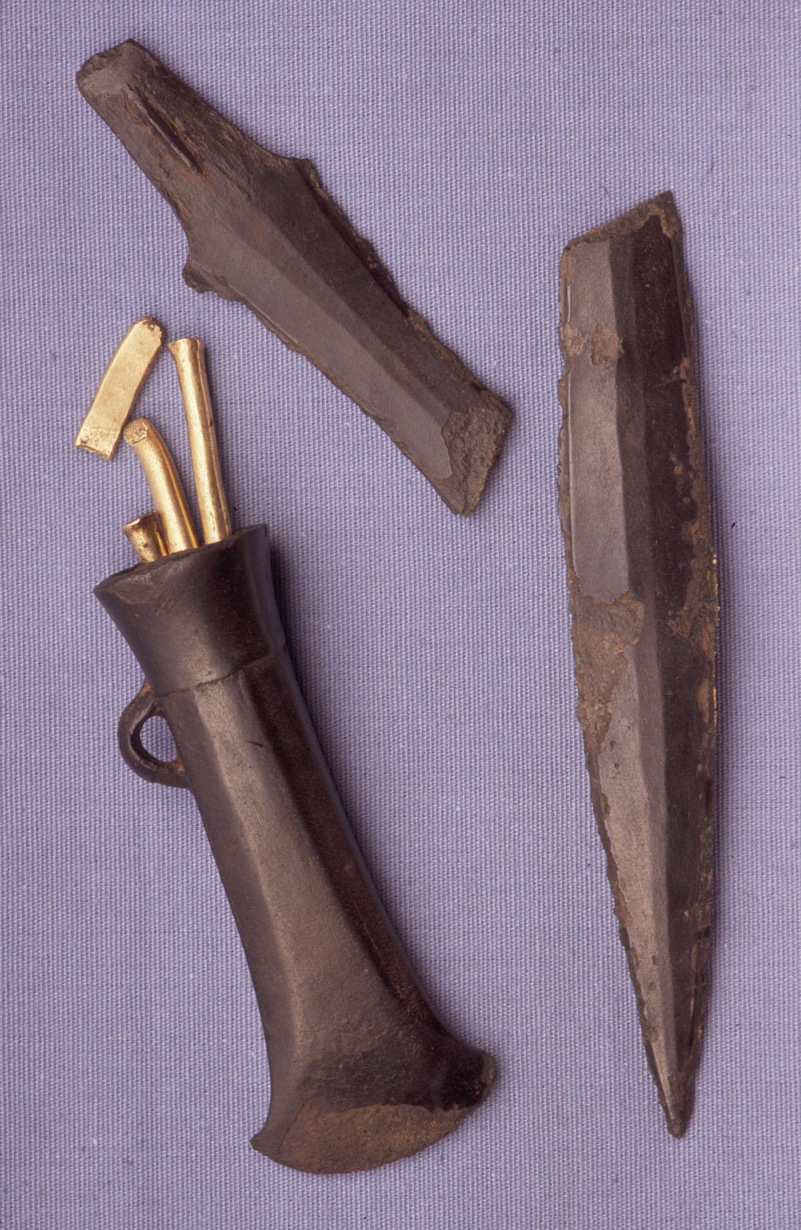 The Rossett Hoard consisting of a socketed axe, a tanged blade and 4 pieces of gold bracelet stored inside the axe. 10th-9th century BCE, now housed at the National Museum Cardiff in Wales.jpeg