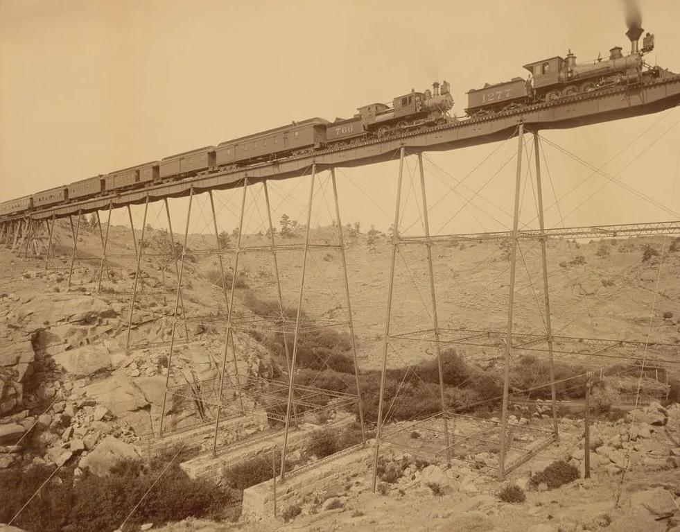 Dale Creek Bridge, a iron bridge in Sherman, Wyoming, USA. A dangerous crossing that required trains to slow down to 4 mph. 1885.jpeg