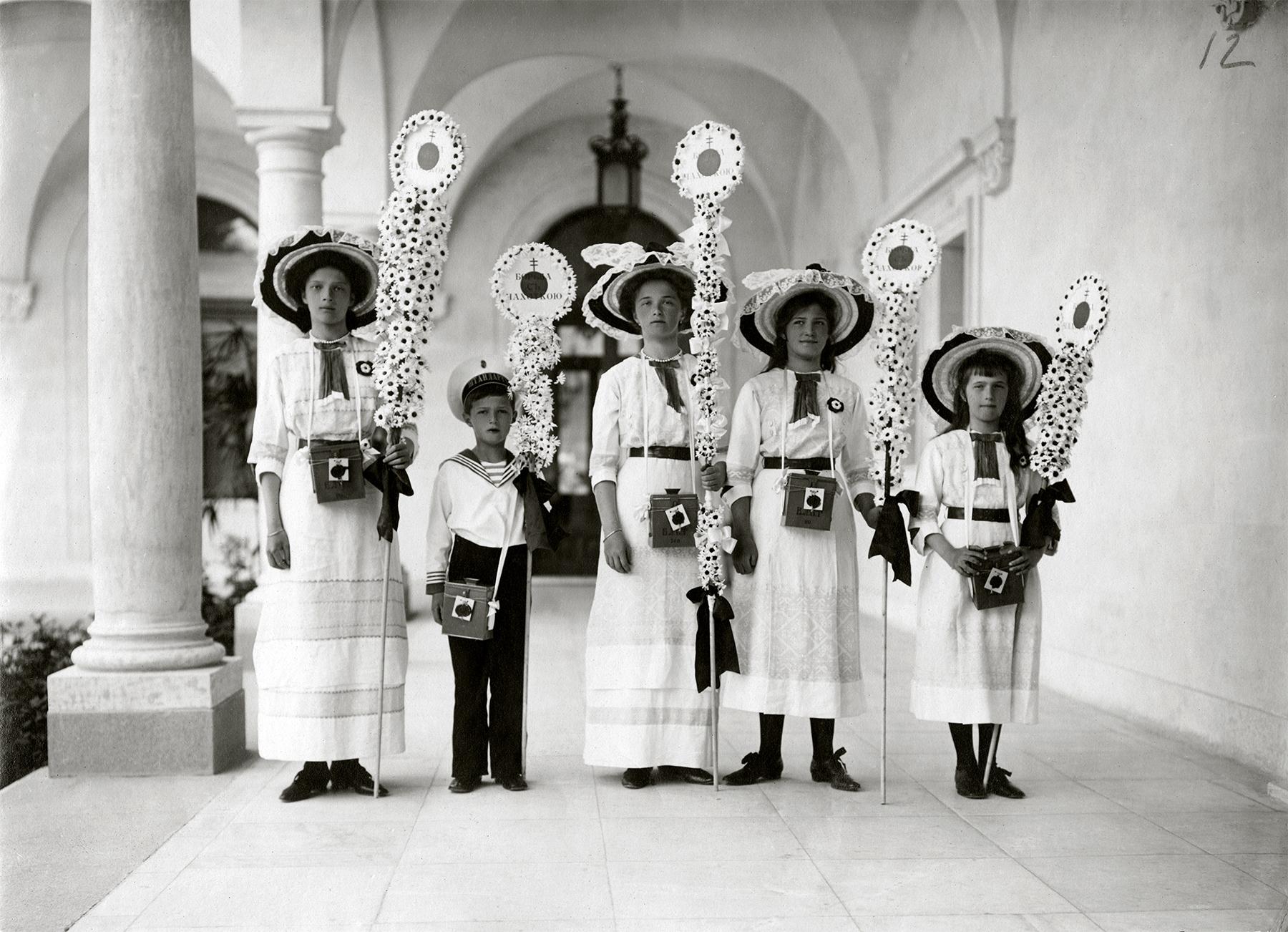 Grand Duchesses Tatiana, Olga, Maria and Anastasia with their brother Tsarevich Alexei at the White Flower festival at the Livadia Palace, Crimea on the 3 May 1912 (20 April 1912 in Julian calendar).jpeg